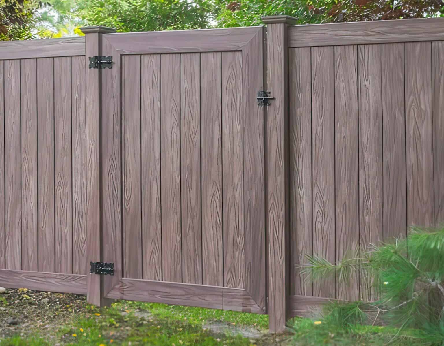 Vinyl single side gate with realistic wooden patterns and earthy tones, separating the backyard from the lush forest.
